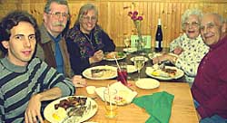 A family enjoying dinner at the Quarterdeck